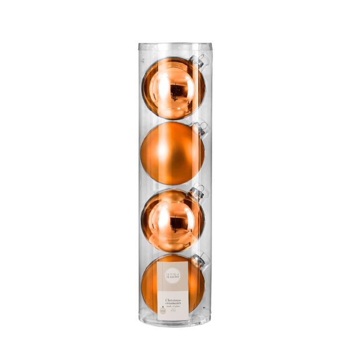 Julekugler i orange farve i glas.