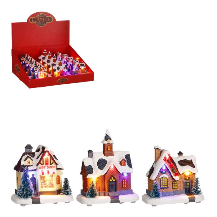 Små julehuse med lys til juleby