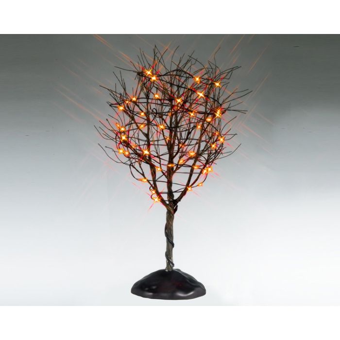 Torrt träd med orange ljus