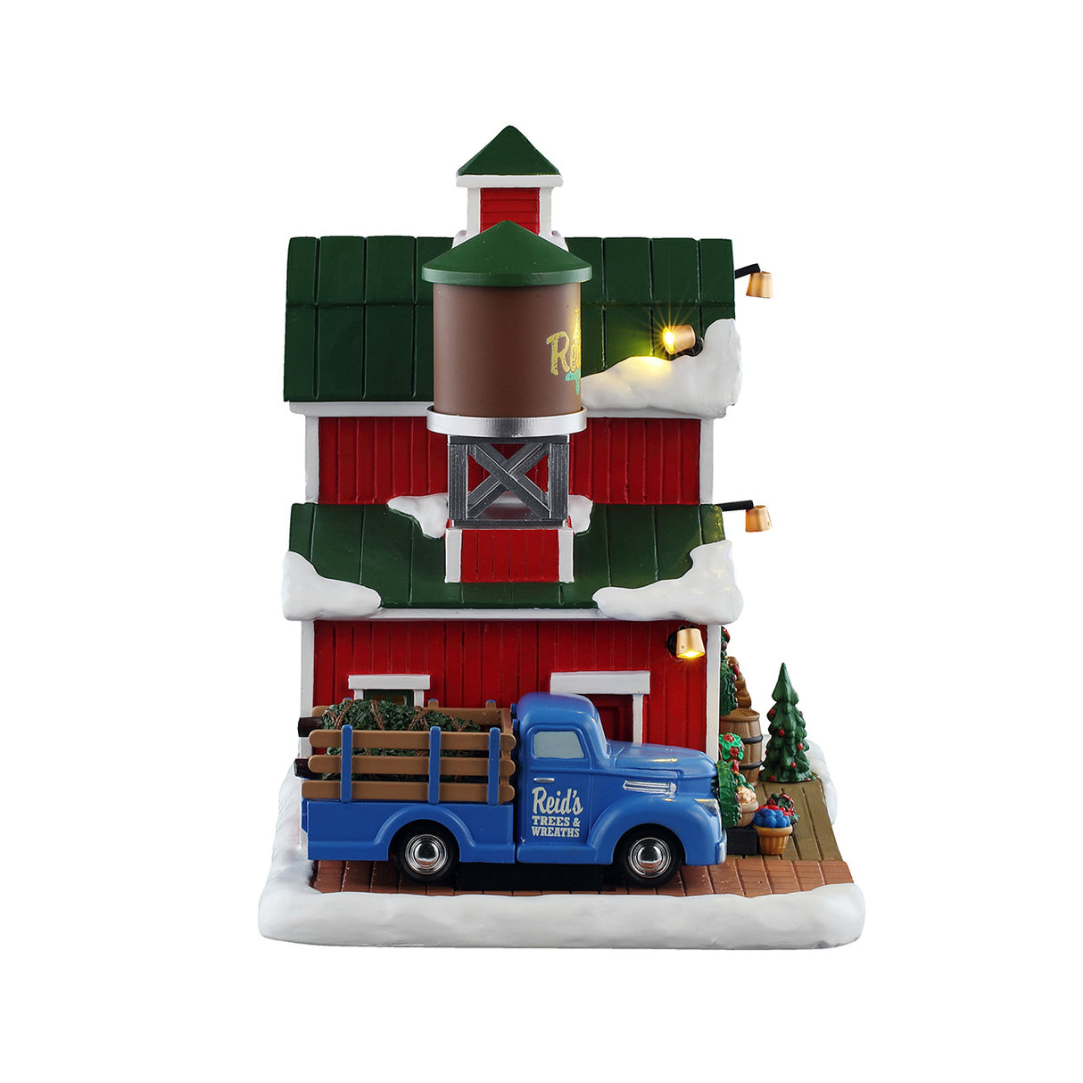 Reid's Trees And Wreaths bondegård til juleby fra Lemax set fra siden med den blå truck af