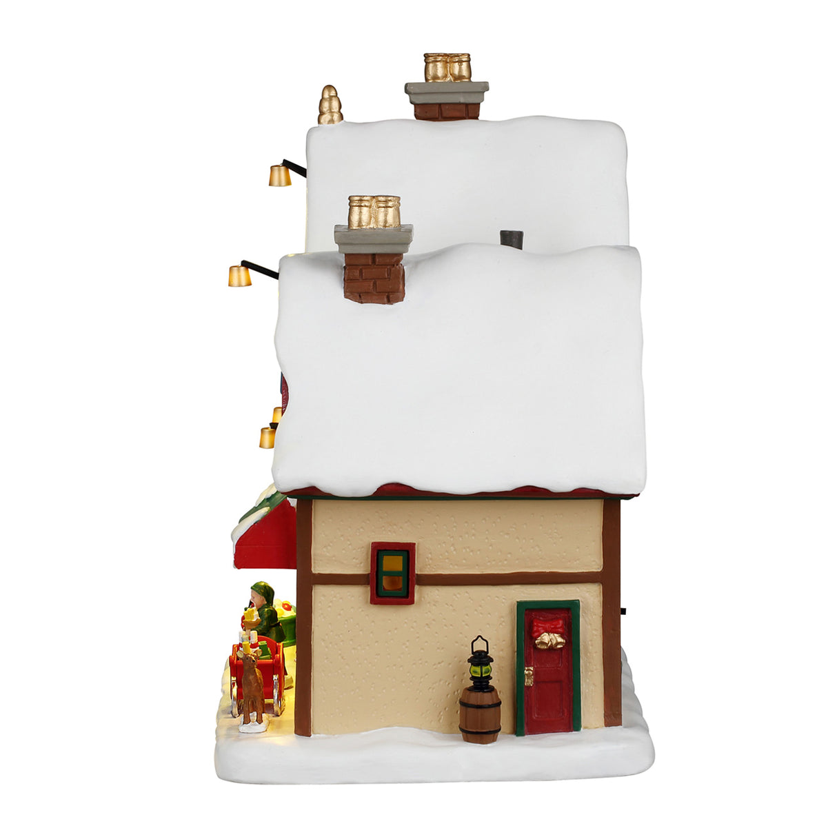 North Pole Christmas Supply hus med lys fra Lemax til juleby set fra siden med lille dør