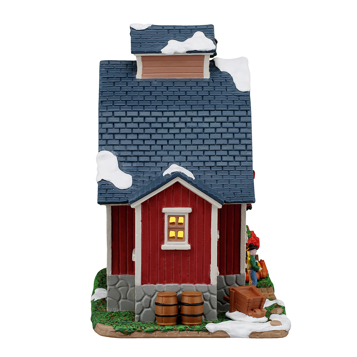Farmer Judd's Place hus med lys til juleby fra Lemax set fra siden med tønder foran
