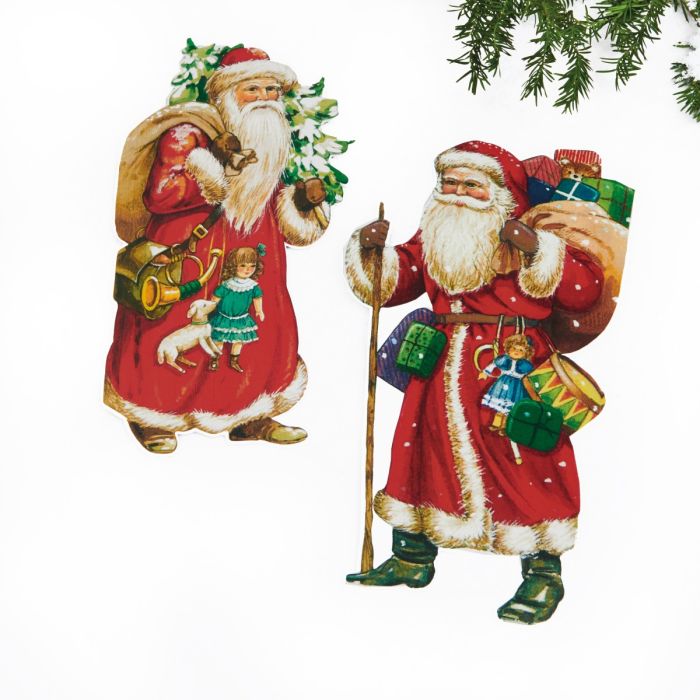 Nostalgisk julemand i karton i to varianter begge med gavesække, en med juletræ, den anden med stok fra Pobra.