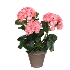 Kunstog hortensia med lyserøde blomster i grå lerpotte
