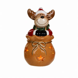 Julfigur i säck med ljus