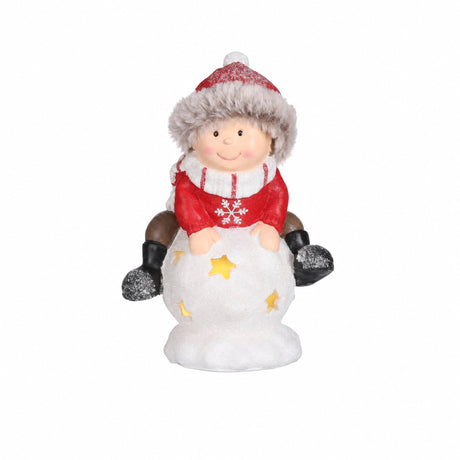 Pojke och flicka med snöboll