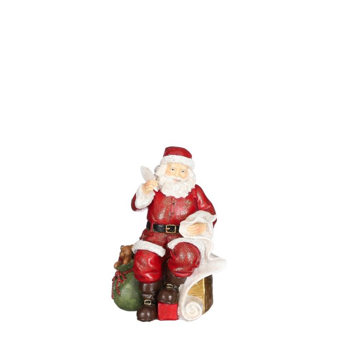 Julemanden sidder med fjerpen, ønskeliste og gavesækken ved sin side fra House of seasons. 