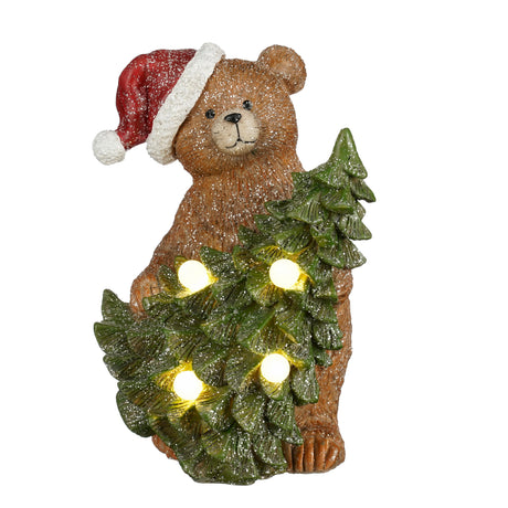 Nalle med julgran och ljus, 23 cm hög, med lätt glitter som dekoration.