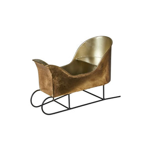 Guldfarvet slæde til dekoration