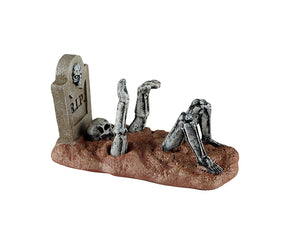 Previous Patient figur med skelet i grav til Halloween