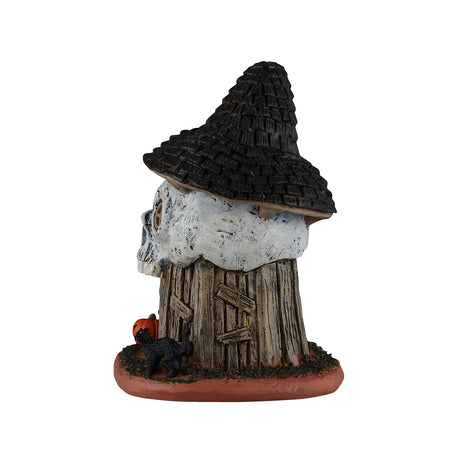 Witch's Skull Hut bygning med lys til Halloween dekoration fra Lemax set fra bagsiden af