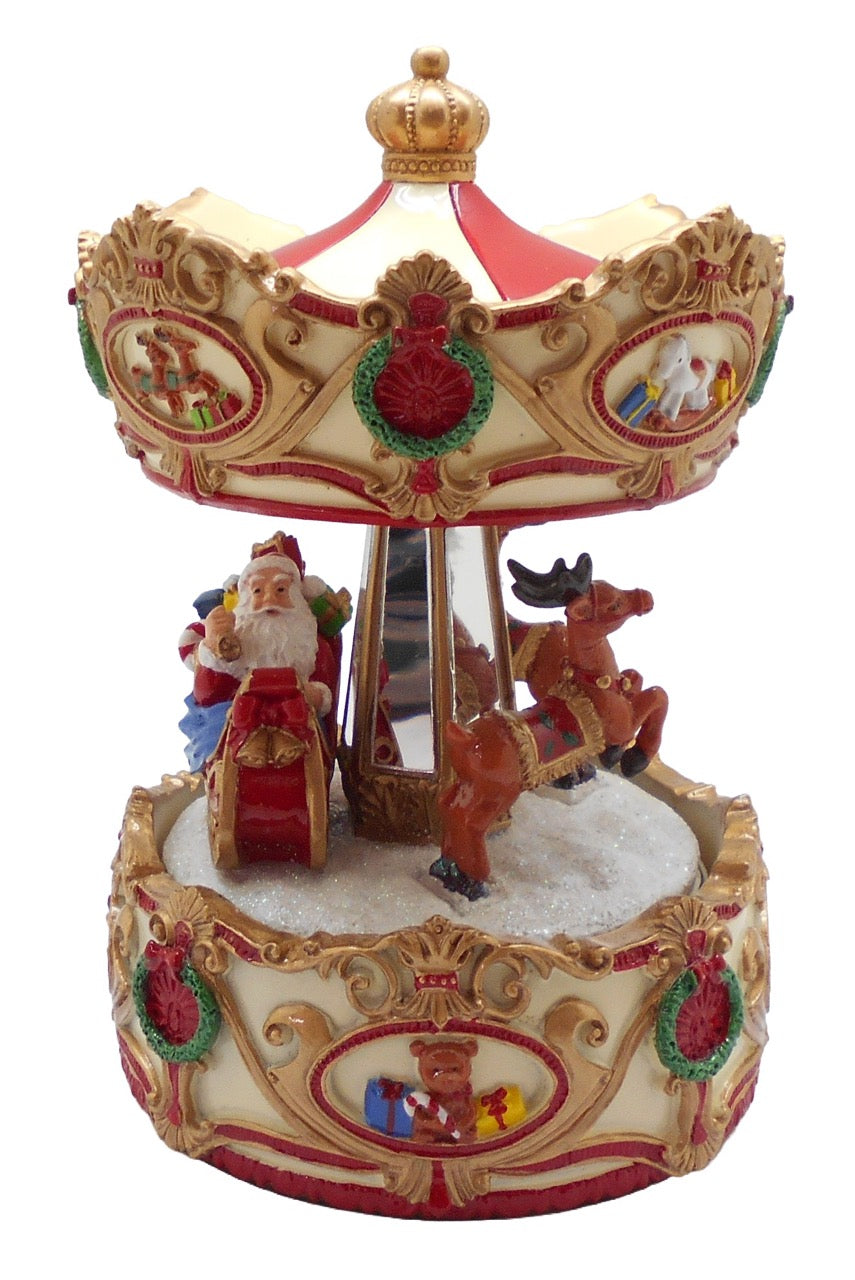 Julkarusell från Musicboxworld med jultomte i släde, renar, snö och krämfärgat tak med röda och gyllene ornament