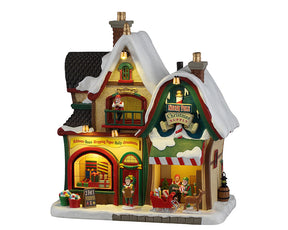 North Pole Christmas Supply hus med lys fra Lemax til juleby