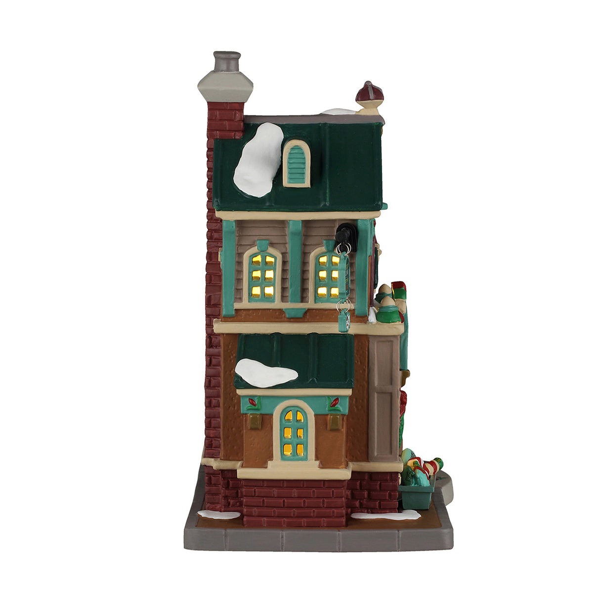 Cathy's Cushion Corner hus med lys til juleby fra Lemax set fra siden af