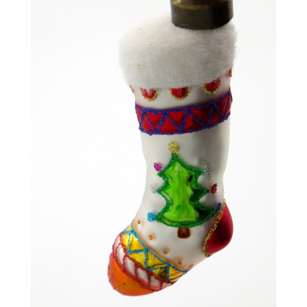 Julkula i glas formad som en liten julsocka från House Doctor i närbild