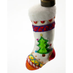 Julkula i glas formad som en liten julsocka från House Doctor i närbild