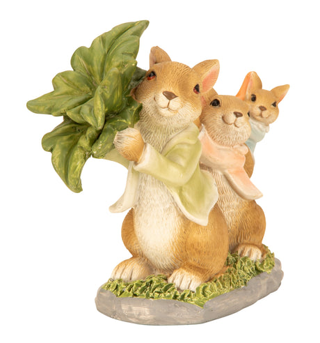 Påskeharer bærer en stor gulerod set forfra