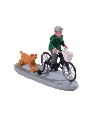 Pojke på cykel med hund